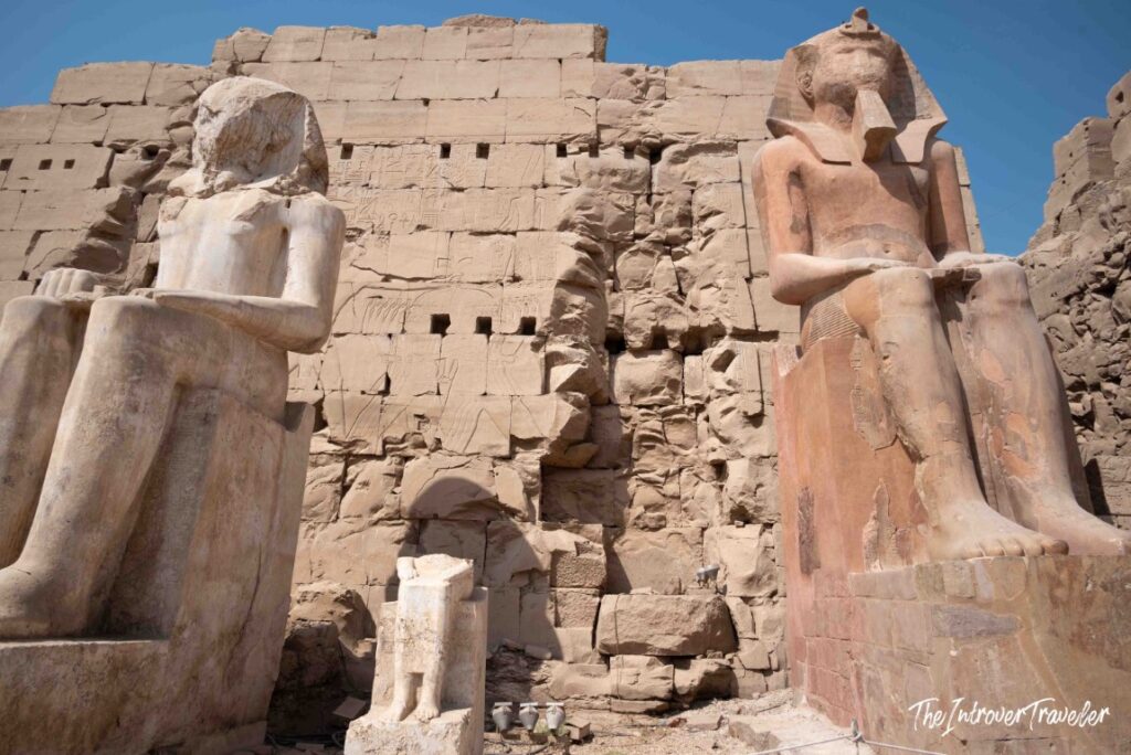 Colossal seated pharaoh statues at the entrance pylon of Karnak Temple Complex, Luxor