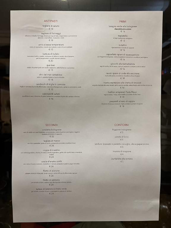 Italian menu at Parlor Bologna listing antipasti, primi, secondi, and contorni dishes with prices