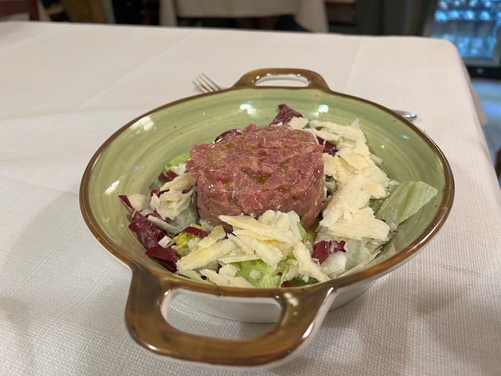Beef tartare with radicchio and Parmesan shavings at Trattoria Casa Mia, Bologna