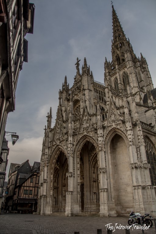 Gothic facade of Saint-Ouen Abbey church in Rouen, Normandy, with ornate spires and pointed arches