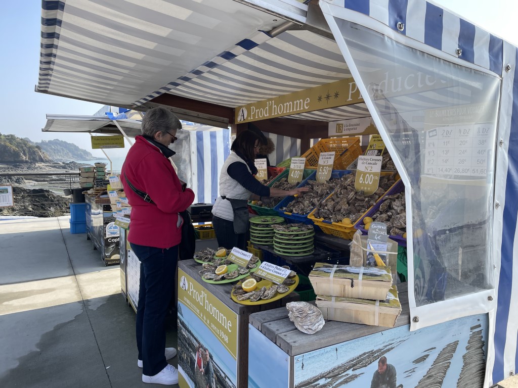 Prod'homme oyster stall at Cancale market, Brittany, selling fresh Huîtres Creuses de Cancale