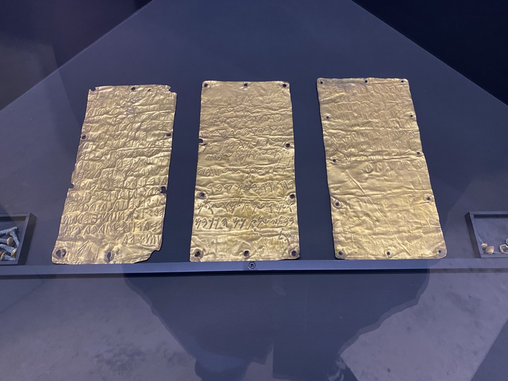 Three ancient gold Pyrgi Tablets with Etruscan and Phoenician inscriptions, displayed at Villa Giulia museum in Rome