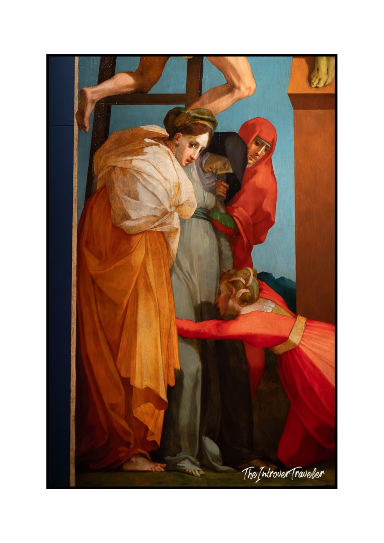 Detail of Pontormo's Deposition from the Cross showing grieving figures in vivid orange and red robes