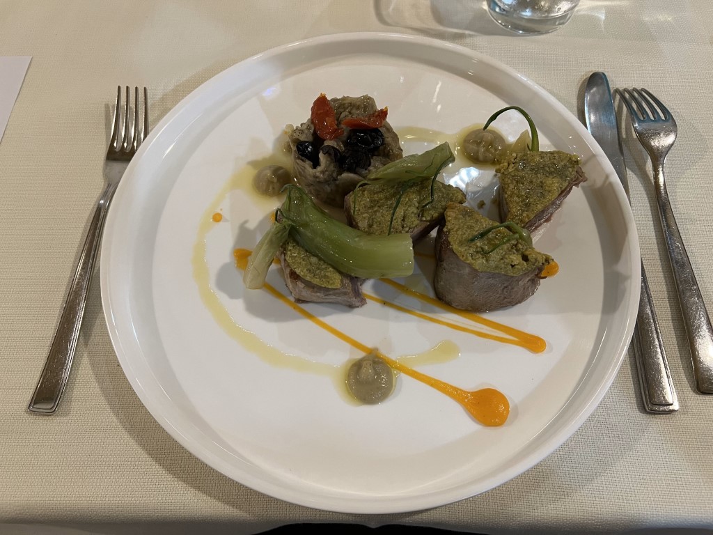 Elegant tuna steak with pistachio crust and caponata at Trattoria da Maro, Bologna