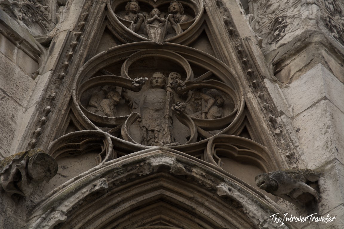 Gothic stone carvings with religious figures on a cathedral portal in Rouen, Normandy