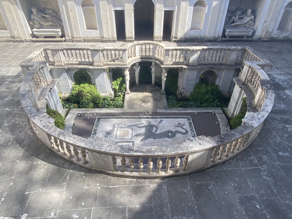 Sunken courtyard of Villa Giulia in Rome, featuring a mosaic floor and semicircular balustrade
