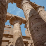 Towering hieroglyph-covered columns of the Great Hypostyle Hall, Karnak Temple Complex, Luxor