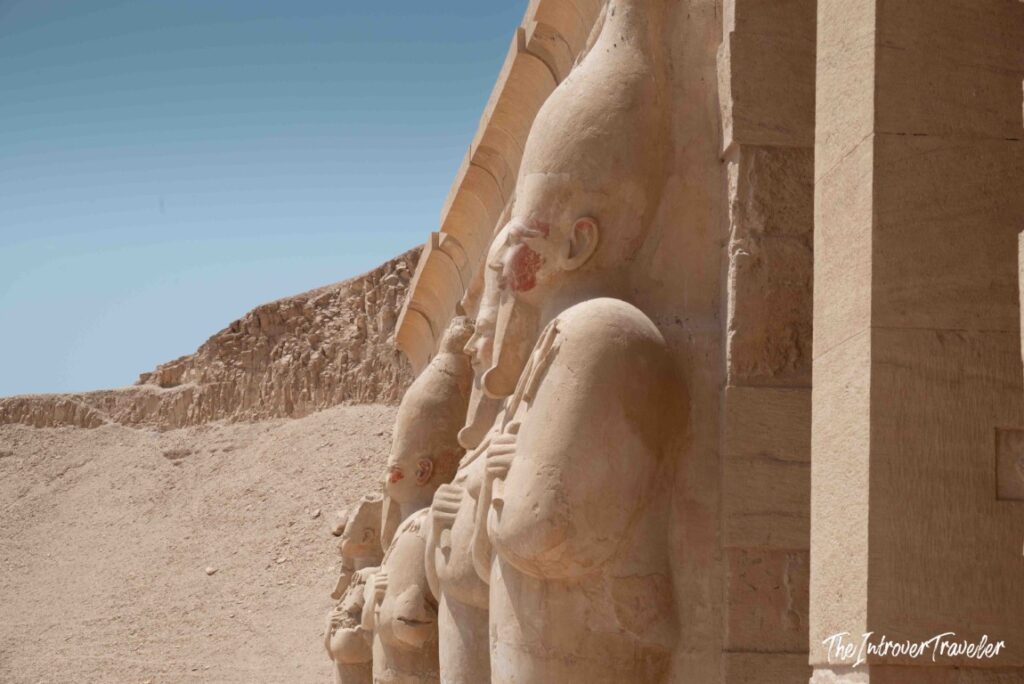 Osiride statues of Hatshepsut lining the upper colonnade at Deir el-Bahari, Luxor