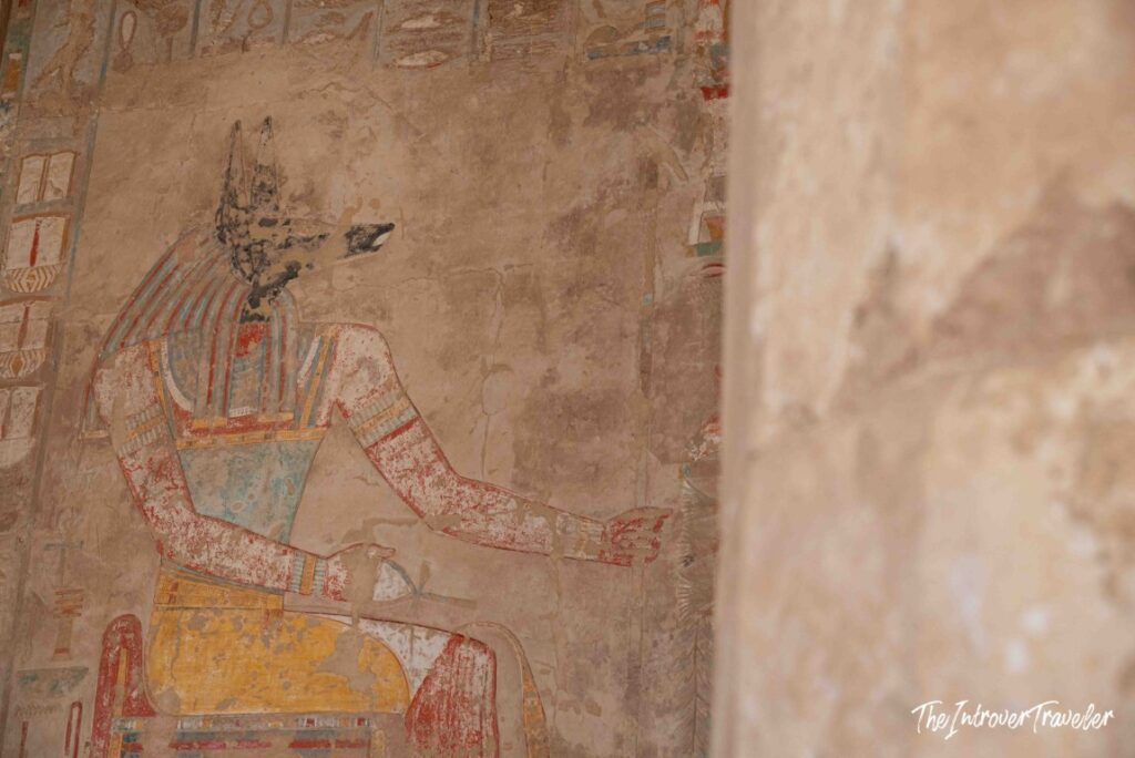 Colorful ancient Egyptian wall painting of Anubis at the Temple of Hatshepsut, Deir el-Bahari