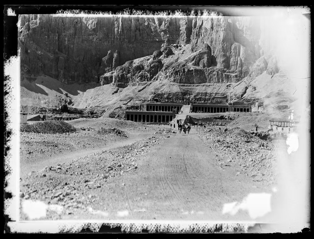 Early photograph of the Temple of Hatshepsut at Deir el-Bahari, showing colonnaded terraces before restoration