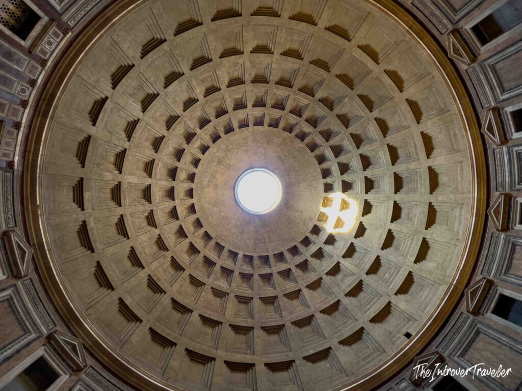 Pantheon dome seen from directly below, with the oculus and a disc of sunlight on the coffers, Rome