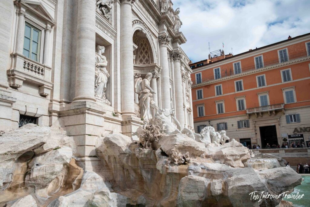 Oceanus and the sea horses with an orange palazzo behind, Piazza di Trevi, Rome