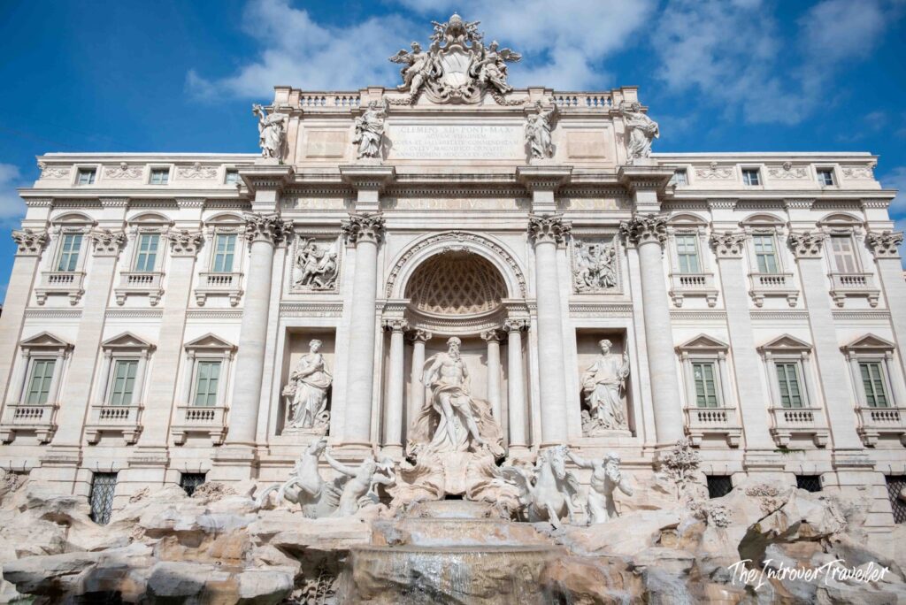 Trevi Fountain seen head-on with no visitors, Palazzo Poli and the triumphal arch, Rome