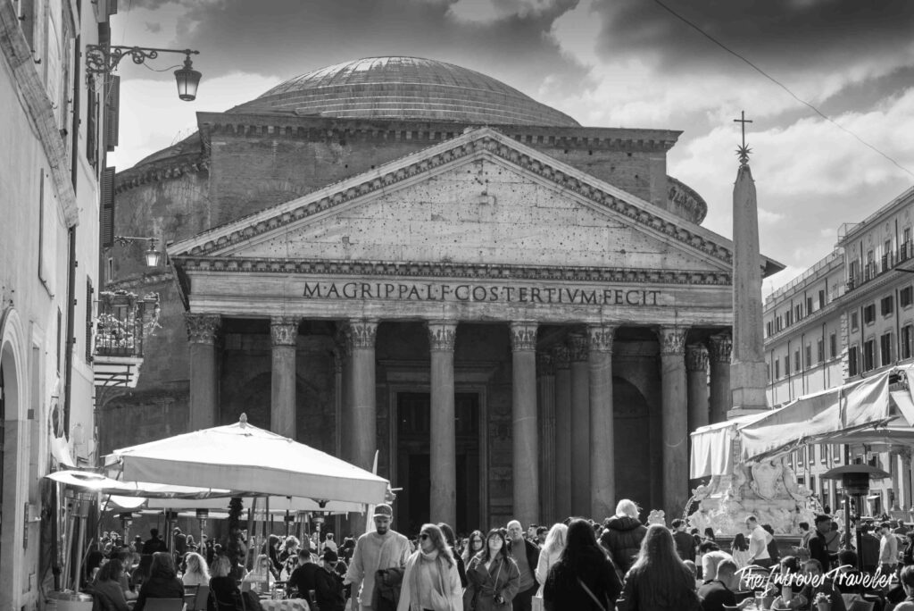 Pantheon façade with the Agrippa inscription and crowds in Piazza della Rotonda, Rome, black and white