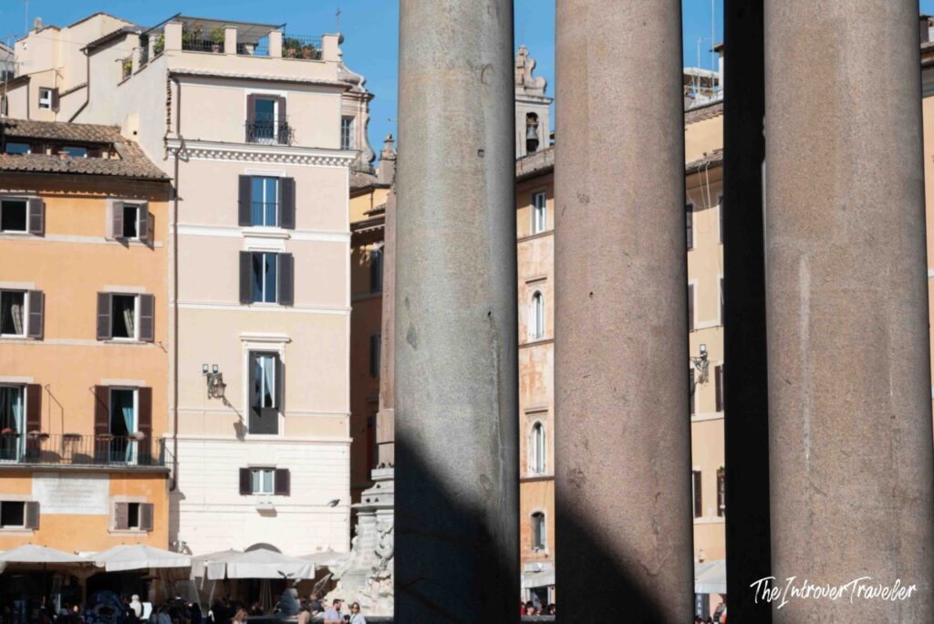 Granite shafts of the Pantheon portico against the buildings of Piazza della Rotonda, Rome